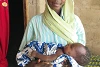 Mary Musa Ali mit ihrem Kind, das sie während der langen Flucht in ihrem Bauch trug (csi)
