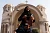 A woman runs in front of the Basilica Church of Heliopolis in the first Egyptian womens‘ race, to raise awareness about violence against women, in Cairo