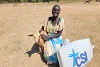Diese befreite Sklavin freut sich über die Milchziege von CSI nach ihrer Rückkehr in den Südsudan. csi